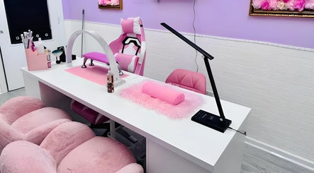 Stylish nail salon at Cariad Beauty, Fauldhouse, Scotland, GB with chic pink decor and professional equipment.
