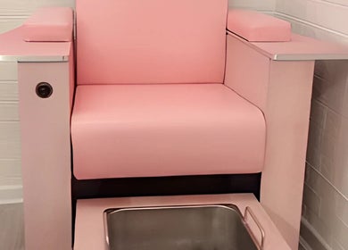 Luxurious pink pedicure chair at Cariad Beauty in Fauldhouse, Scotland, GB, enhancing client relaxation and comfort.