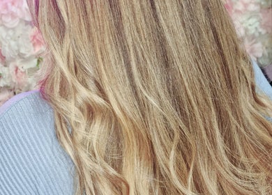 Blonde wavy hair in a salon setting at Cariad Beauty, Fauldhouse, Scotland, GB.