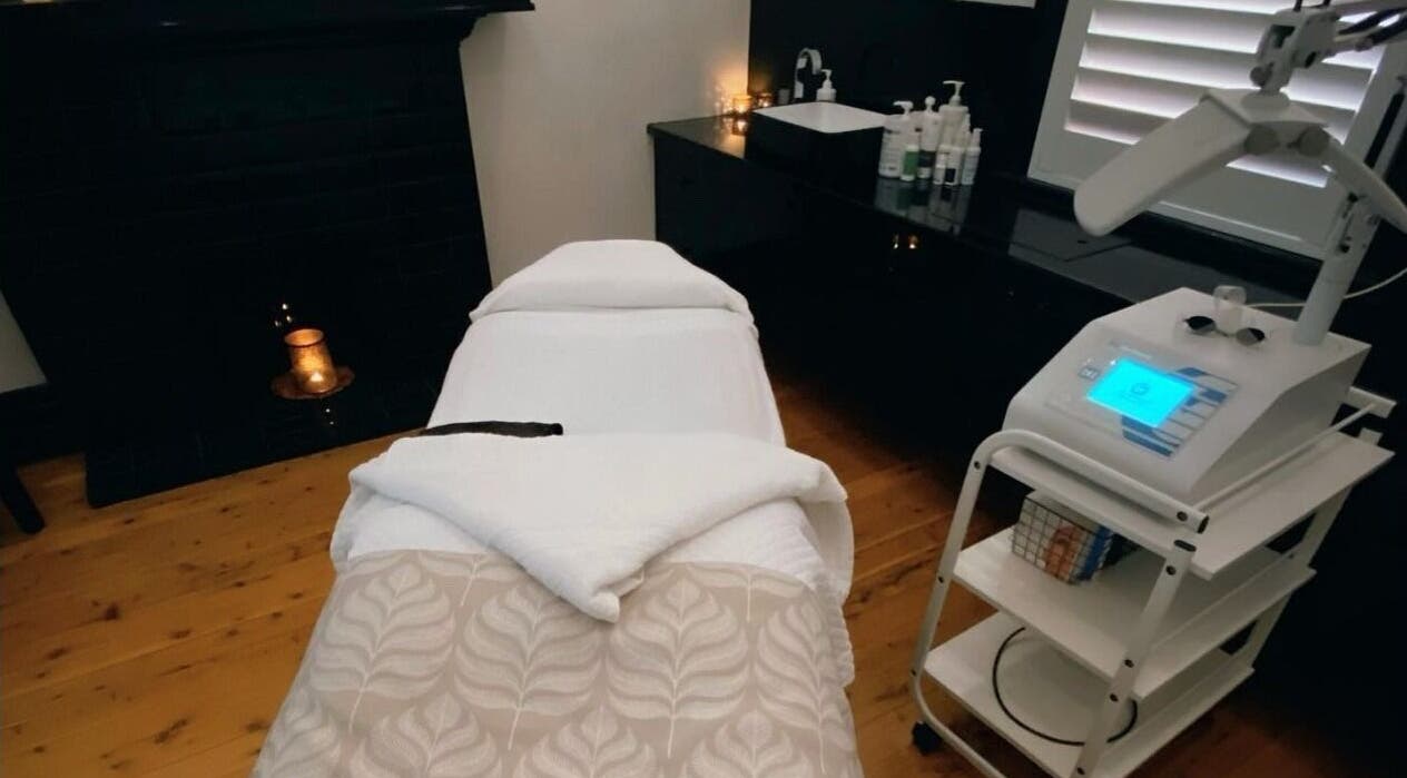 Treatment room in Circa 1929, Wagga Wagga, New South Wales, AU showing a massage bed and ambient lighting.