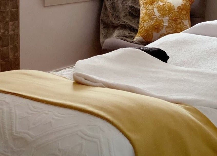 Relaxing spa setting at Circa 1929, Wagga Wagga, New South Wales, AU featuring cozy blankets and plush pillows.