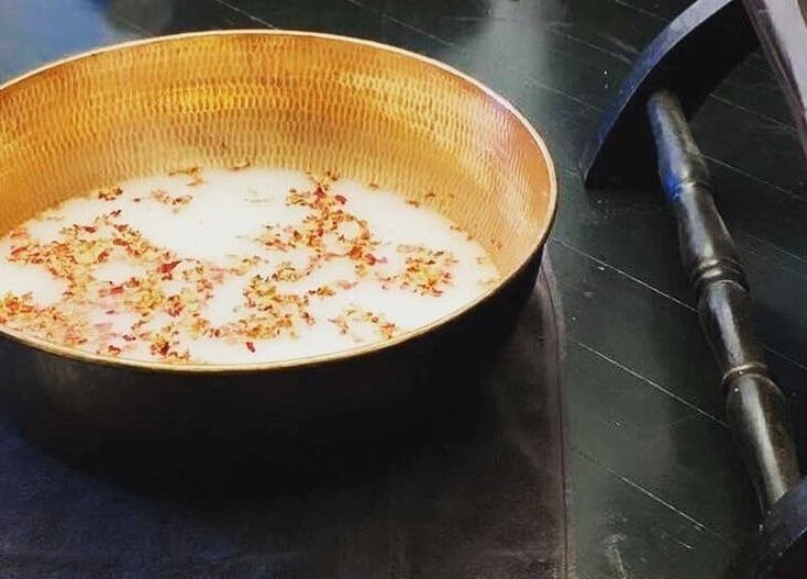 Luxurious spa bowl with floral milk at Circa 1929, Wagga Wagga, New South Wales, AU.