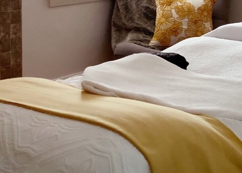 Cozy massage bed with plush decor at Circa 1929 in Wagga Wagga, New South Wales, AU.