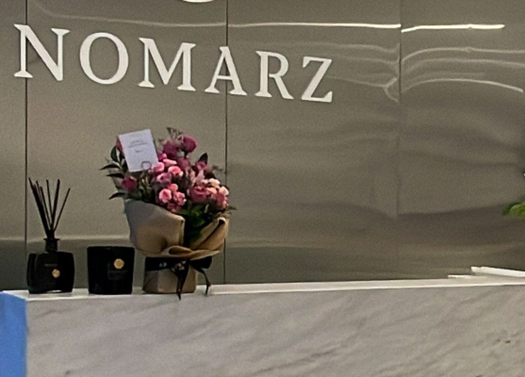 Reception area of Nomarz Beauty Lounge with flowers in Al Khobar, Eastern Province, SA.
