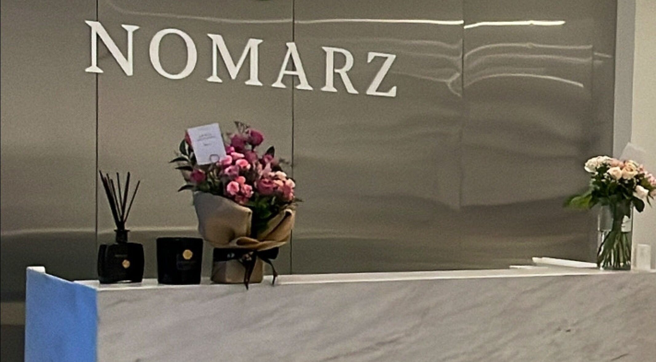 Reception area of Nomarz Beauty Lounge with flowers in Al Khobar, Eastern Province, SA.