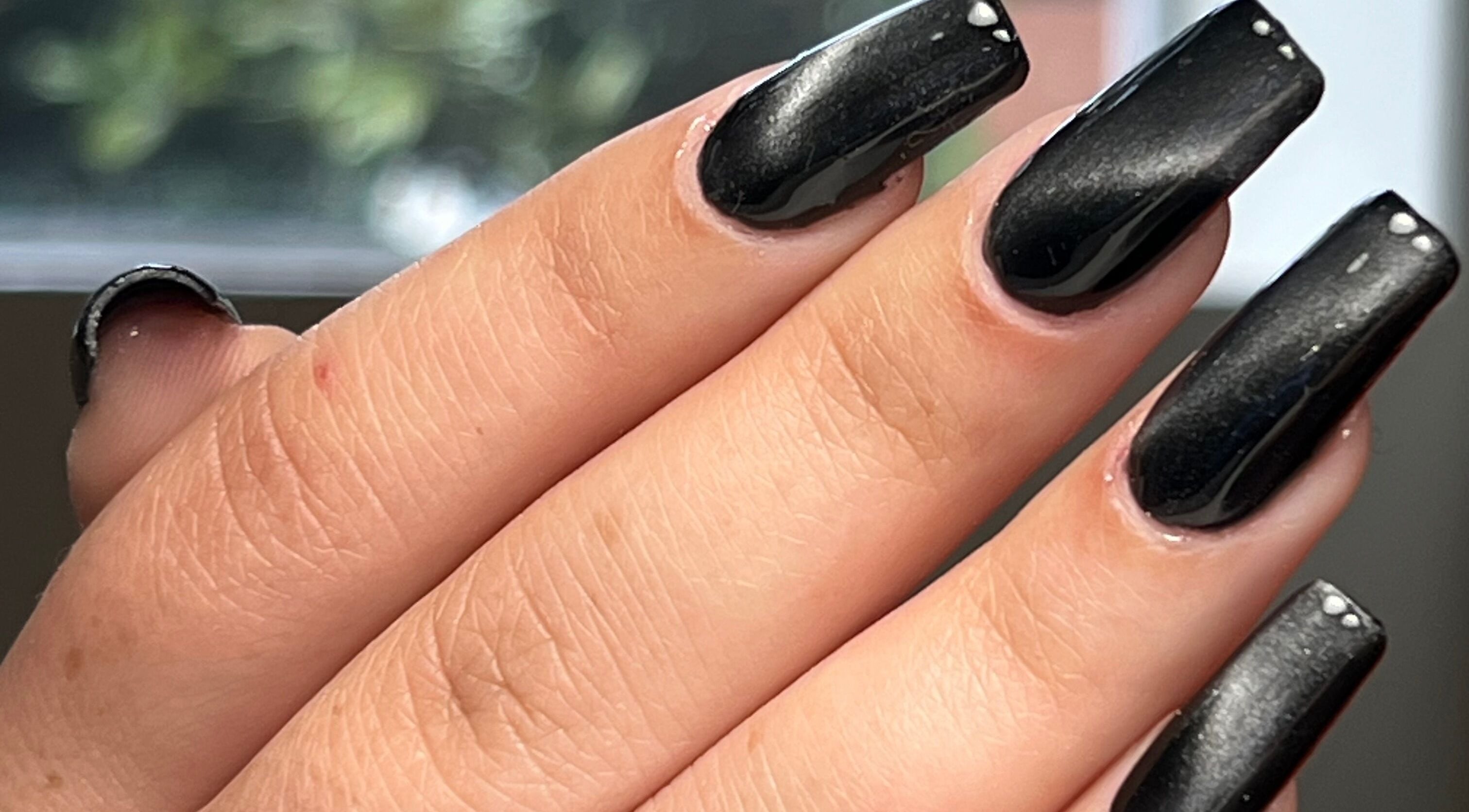 Close-up of glossy black nails at Danii Nails in Bowden, South Australia, AU, exemplifying elegance and style.