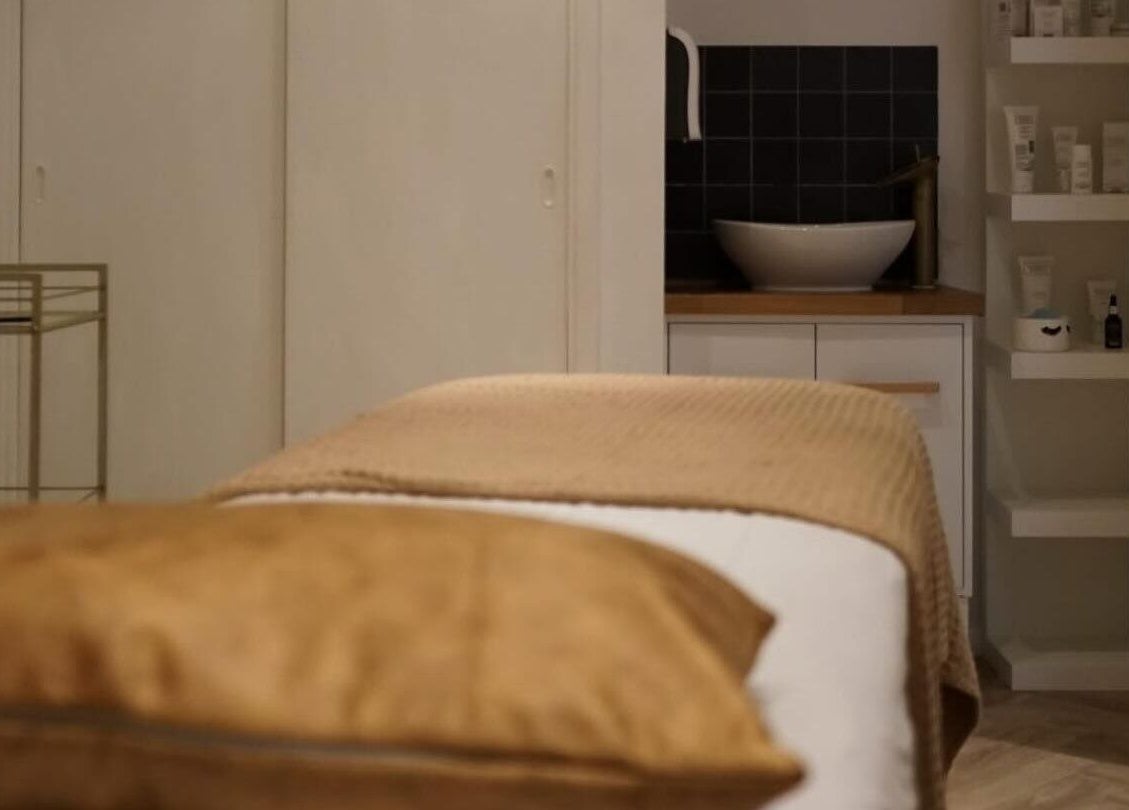 Massage table at Le Roux Beauty in Langford, England, GB, offering a serene spa experience.