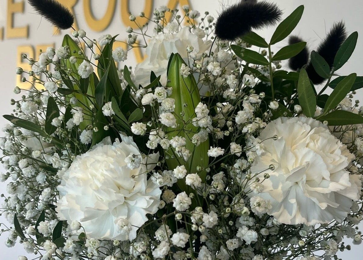 Elegant white floral display at Le Roux Beauty, Langford, England, GB.