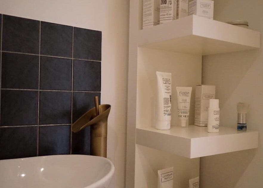 Stylish bathroom corner with skincare products at Le Roux Beauty, Langford, England, GB.