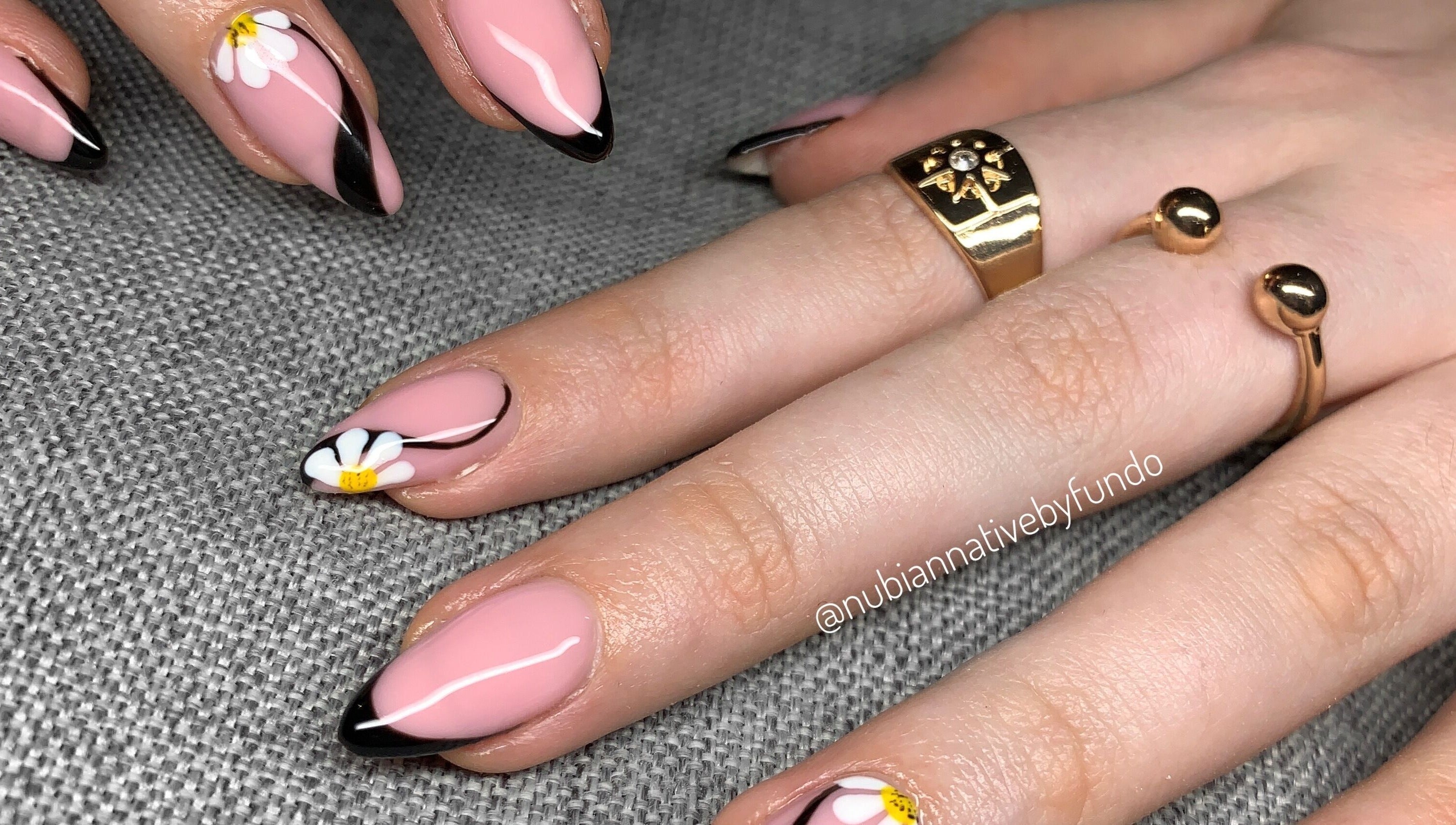 Floral nail art design at Nubian Native by Fundo, Randburg, Gauteng, ZA showcasing pink nails with daisies.