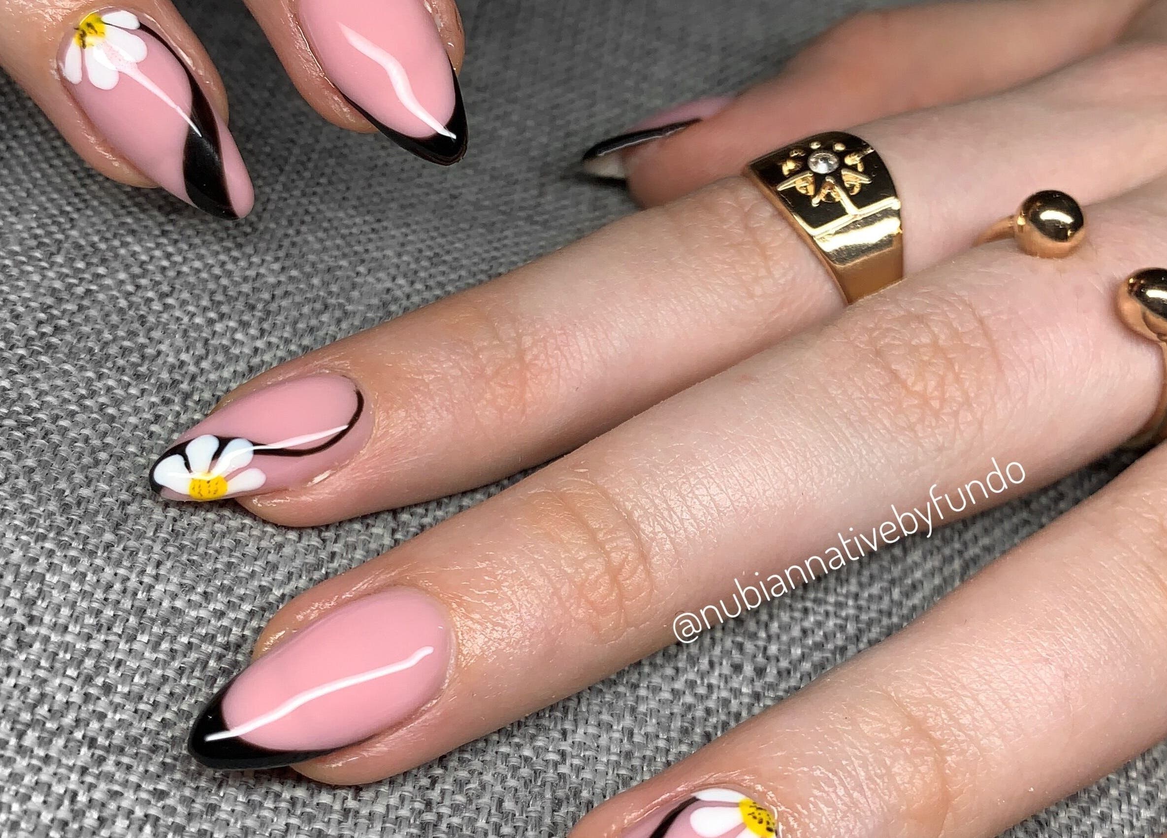 Floral nail art design at Nubian Native by Fundo, Randburg, Gauteng, ZA showcasing pink nails with daisies.