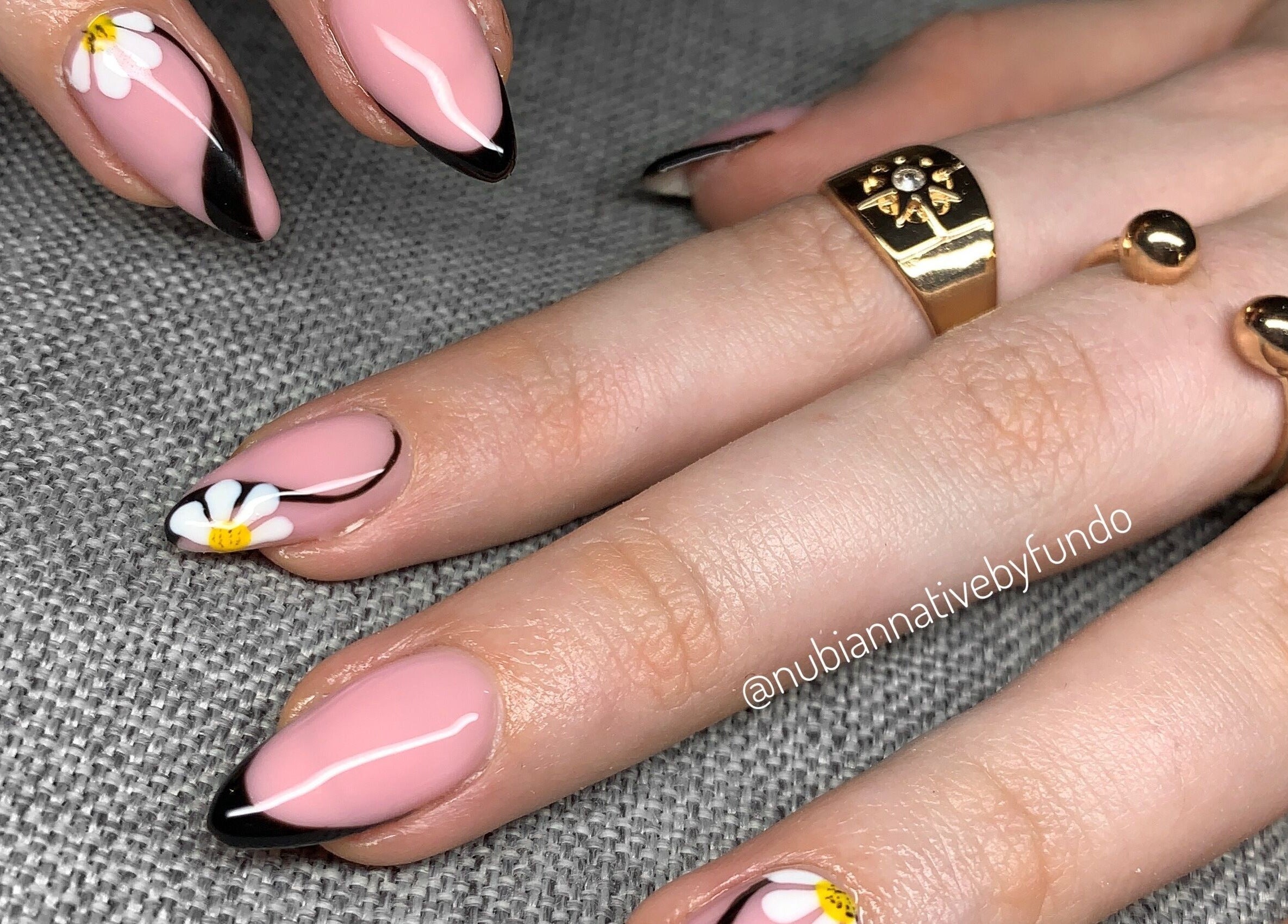 Floral nail art design at Nubian Native by Fundo, Randburg, Gauteng, ZA showcasing pink nails with daisies.