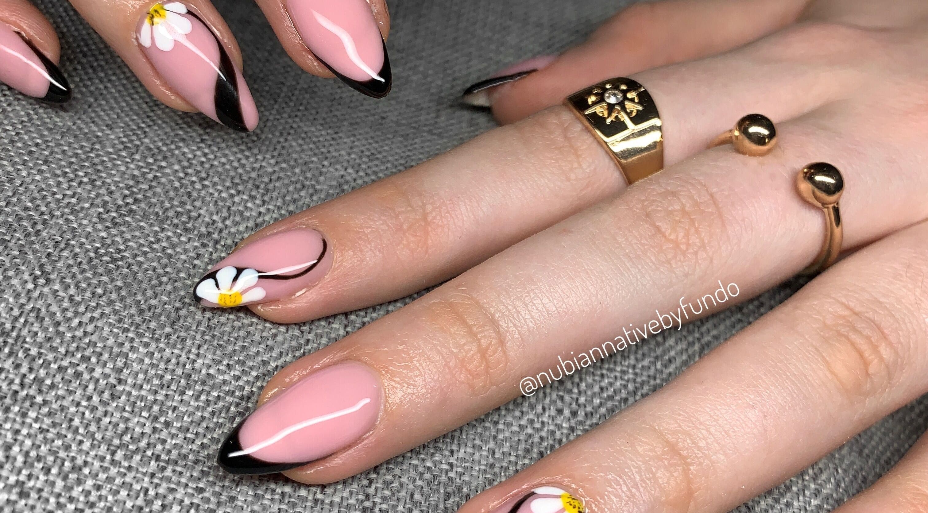 Floral nail art design at Nubian Native by Fundo, Randburg, Gauteng, ZA showcasing pink nails with daisies.