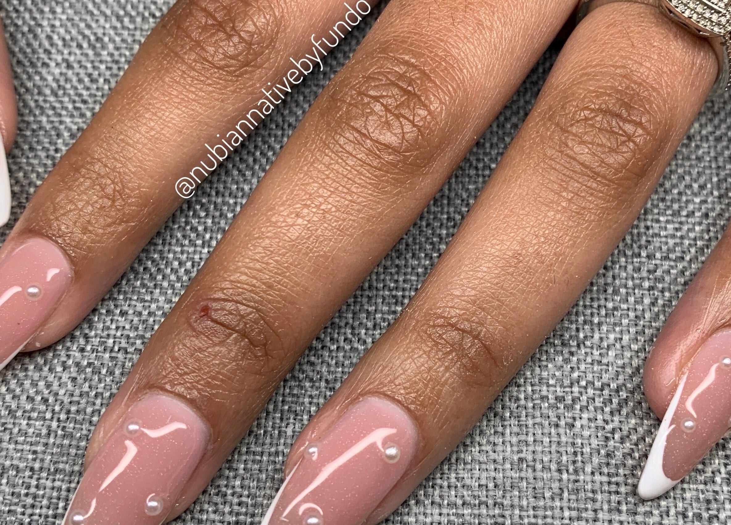 Elegant nail design with pearls by Nubian Native by Fundo, Randburg, Gauteng, ZA.