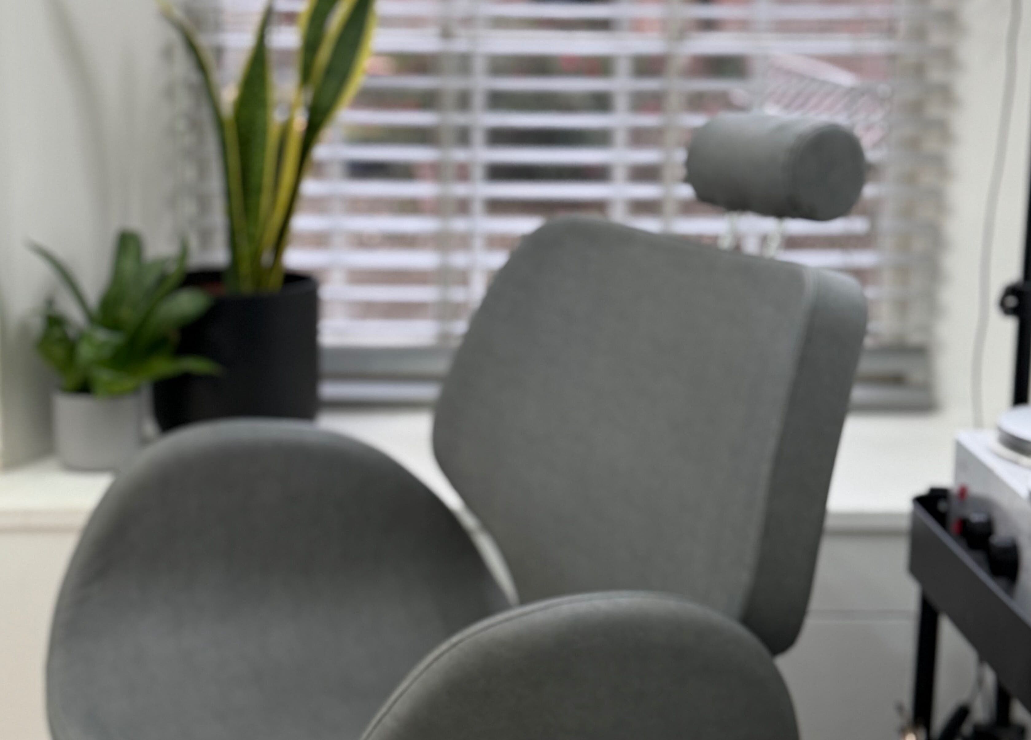 Comfortable treatment chair at Blossom Beauty in Forfar, Scotland, GB, with sleek decor and natural light.