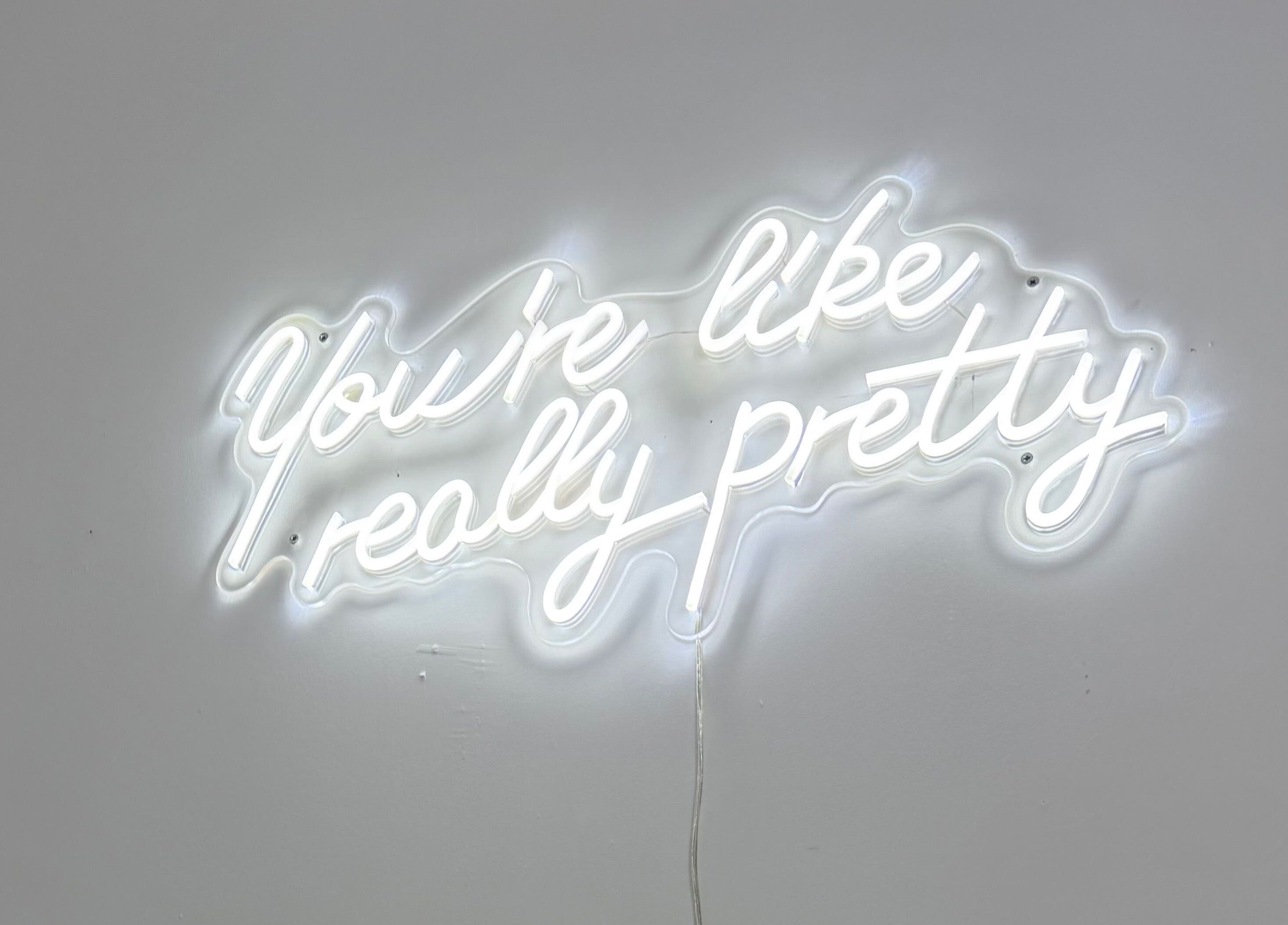 Neon sign with 'You're like really pretty' at Blossom Beauty, Forfar, Scotland, GB.
