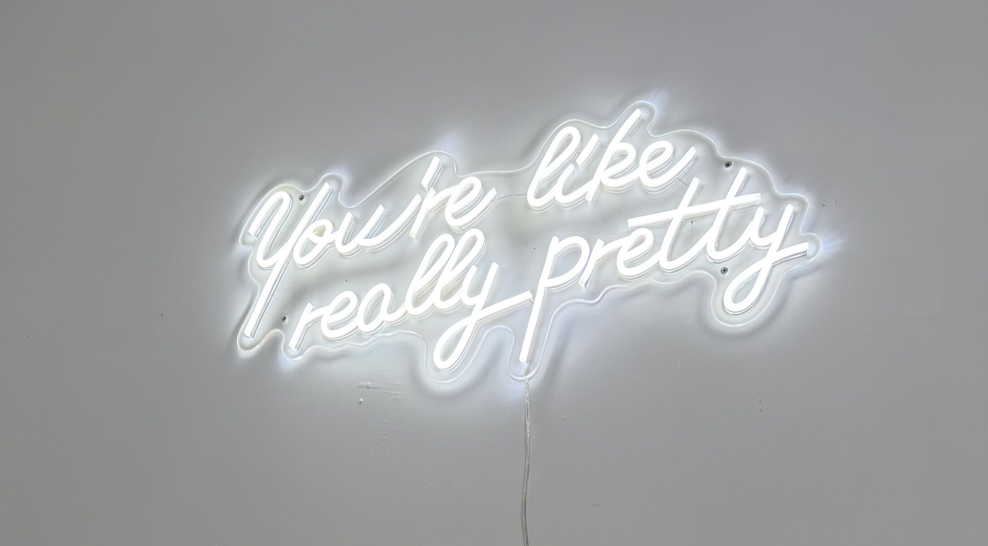 Neon sign with 'You're like really pretty' at Blossom Beauty, Forfar, Scotland, GB.