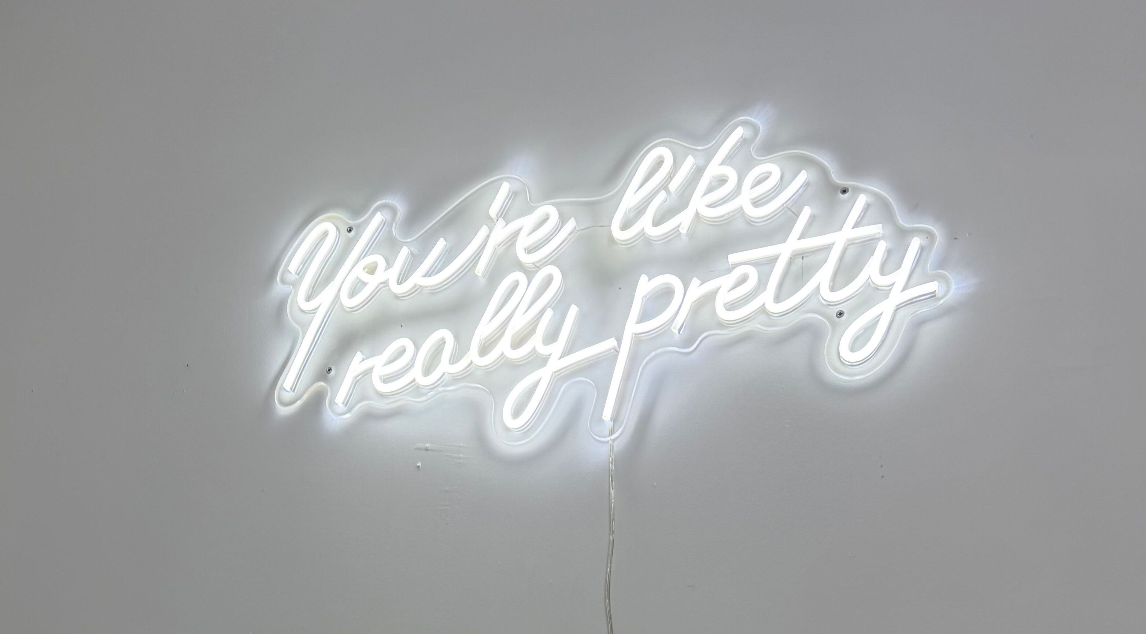 Neon sign with 'You're like really pretty' at Blossom Beauty, Forfar, Scotland, GB.