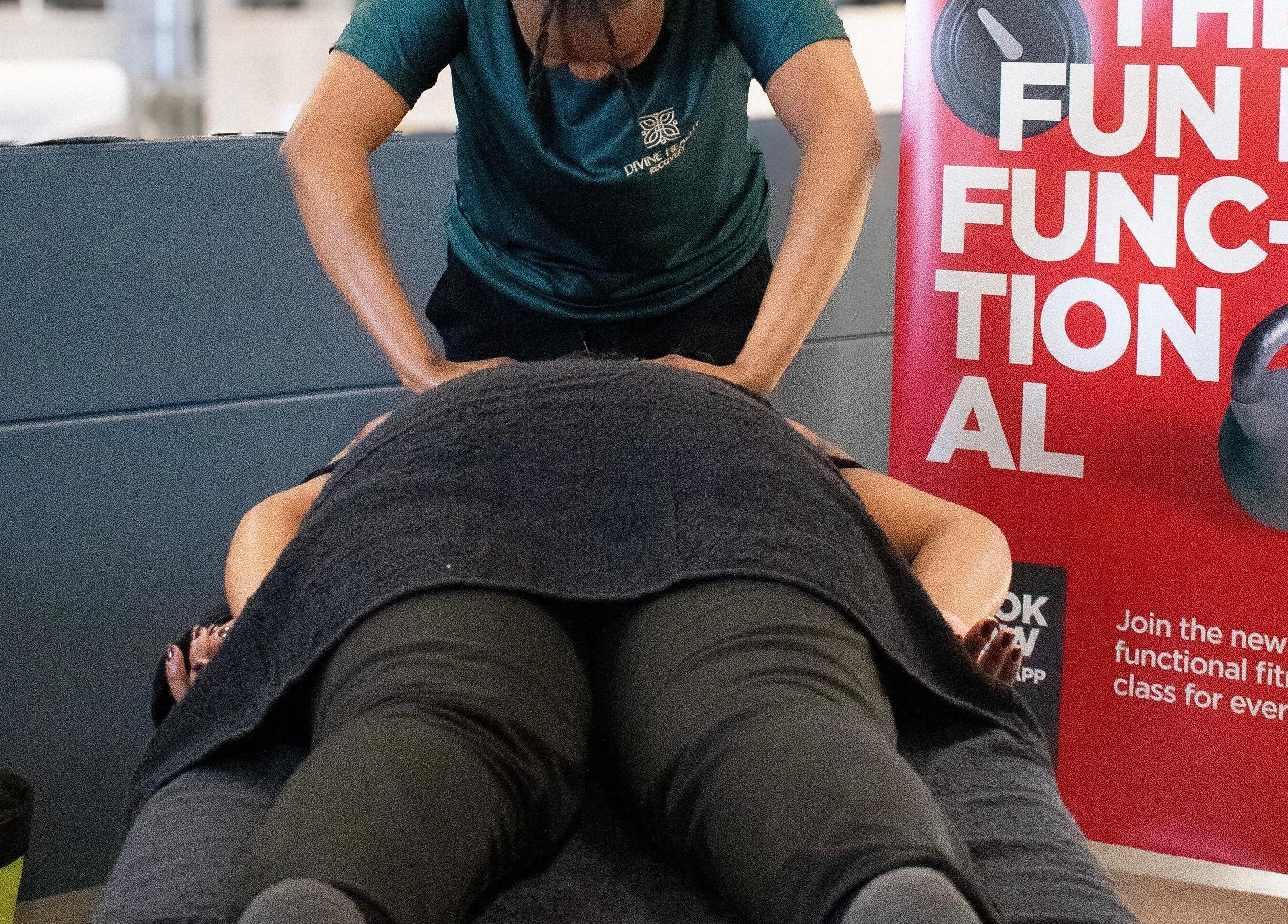 Therapist gives massage at Divine Health Recovery Virgin Active 14th Avenue Roodepoort, Roodepoort, Gauteng, ZA.