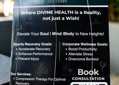Promotional board at Divine Health Recovery Deloitte, Midrand, Gauteng, ZA highlighting recovery and wellness goals.