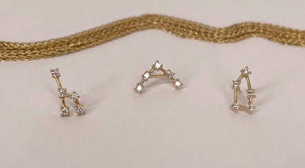 Elegant gold constellation jewelry set at Katarza, Split, Splitsko-dalmatinska Županija, HR, on display.