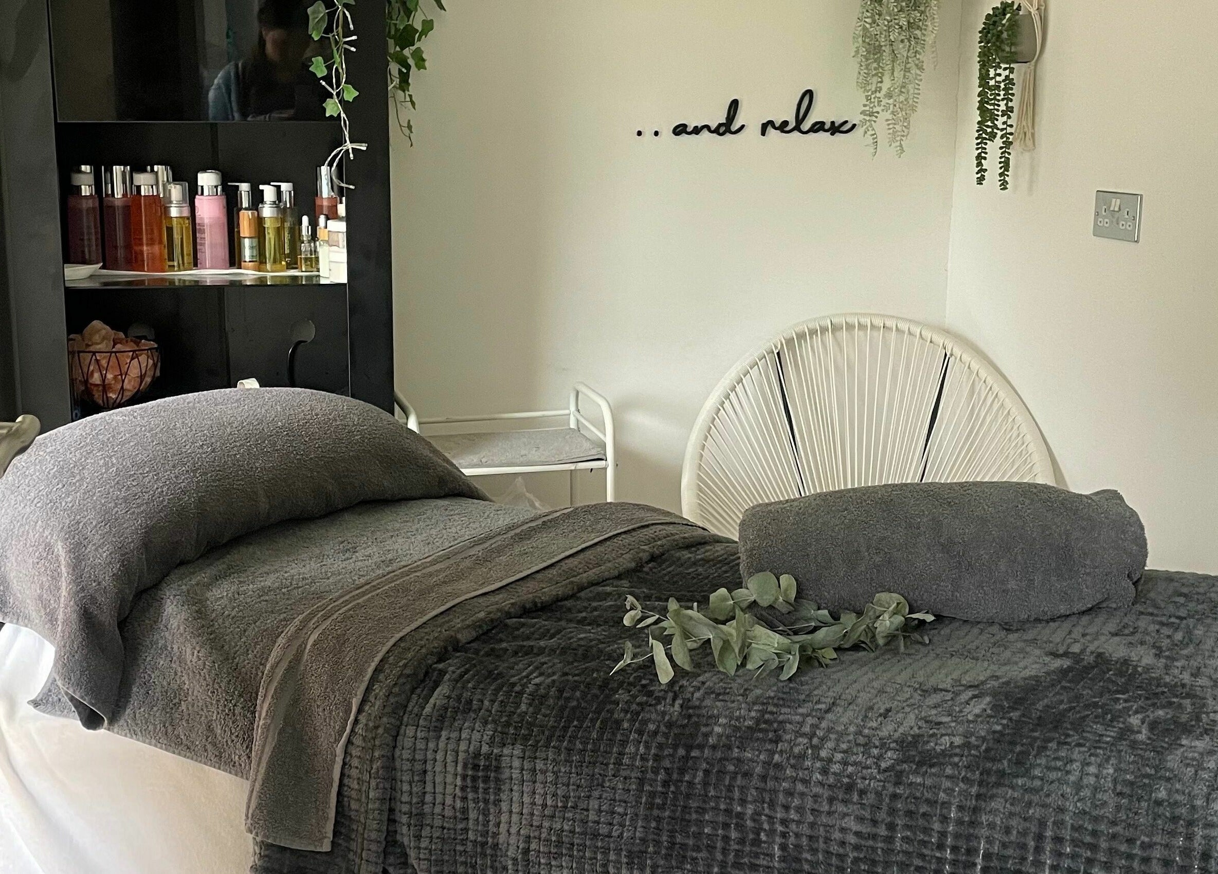 Cozy treatment room at Achill Spa in Knowle, England, GB exudes relaxation with plush decor and calming ambiance.