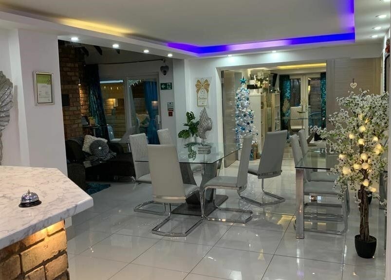 Achill Spa's modern interior with stylish decor and ambient lighting in Knowle, England, GB.