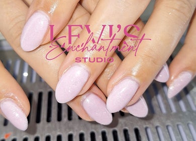 Freshly manicured nails at Levi's Enchantment Studio, Torquay, England, GB, showcasing soft pink polish.