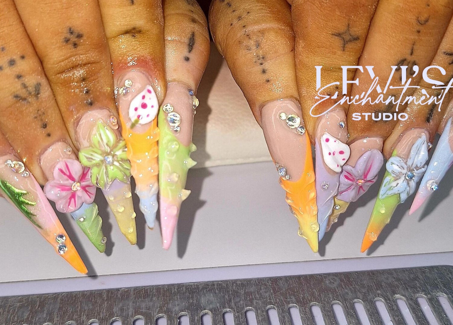 Intricate floral nail art at Levi's Enchantment Studio, Torquay, England, GB, showcasing vibrant 3D designs.