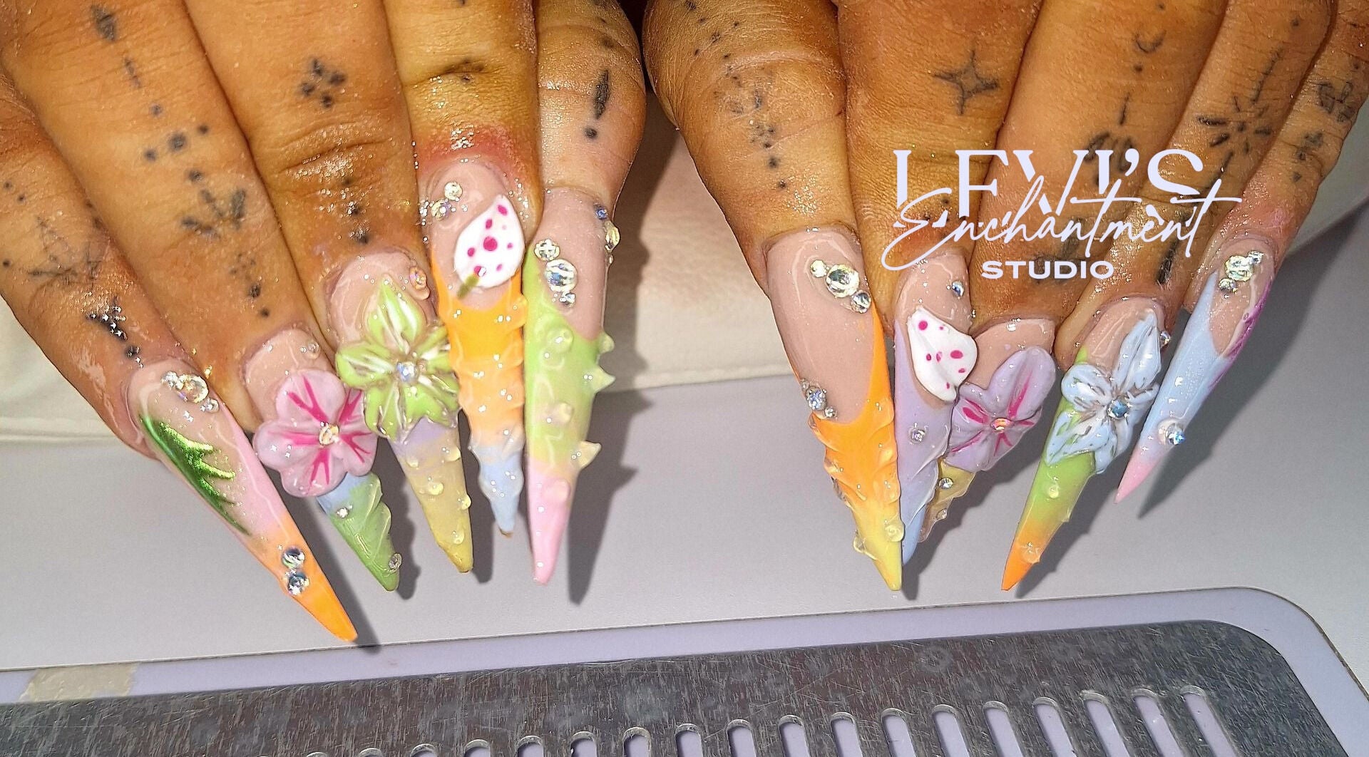 Intricate floral nail art at Levi's Enchantment Studio, Torquay, England, GB, showcasing vibrant 3D designs.