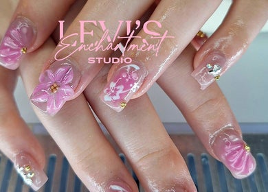 Elegant pink floral nail art at Levi's Enchantment Studio, Torquay, England, GB.