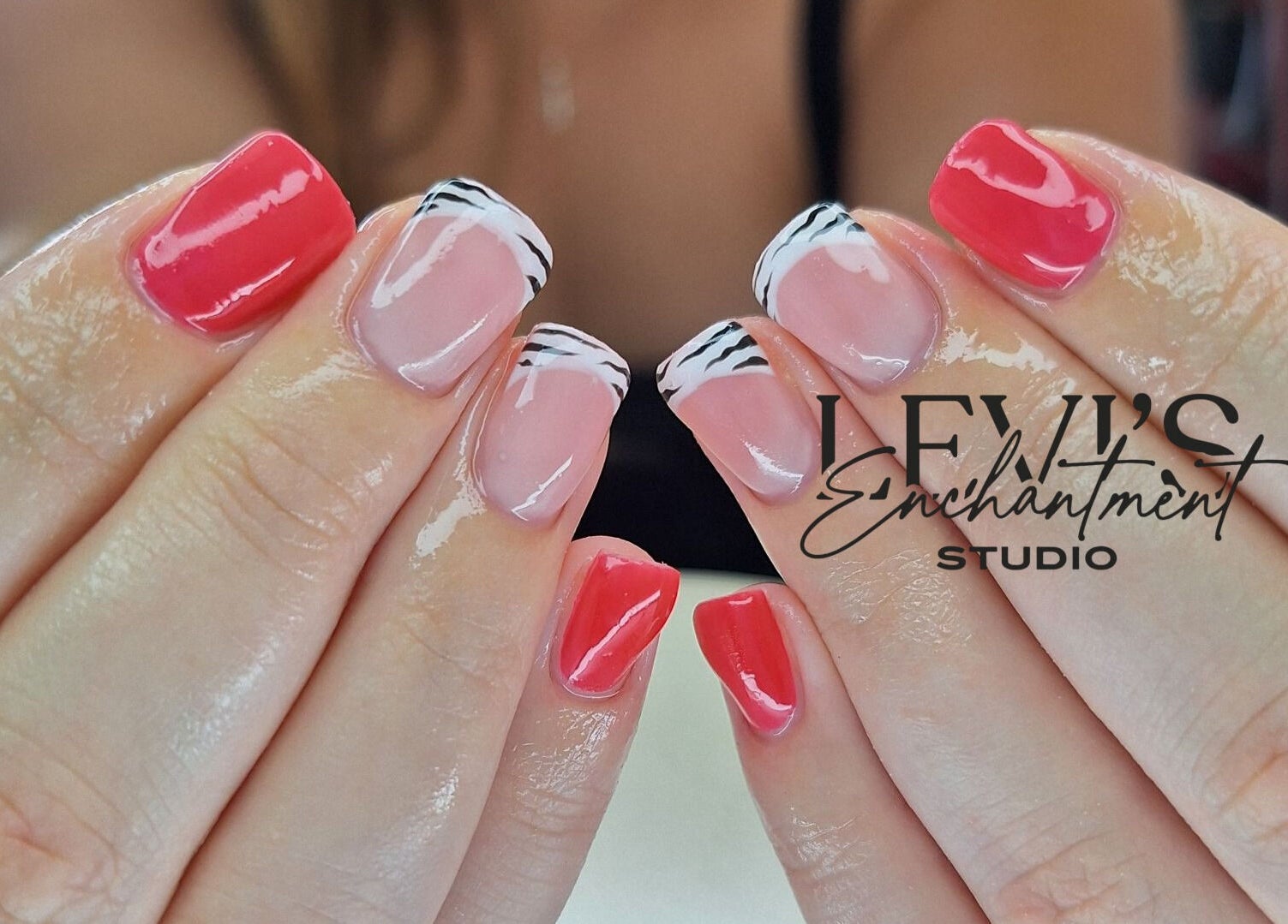 Stylish nails with red and zebra tips at Levi's Enchantment Studio, Torquay, England, GB.