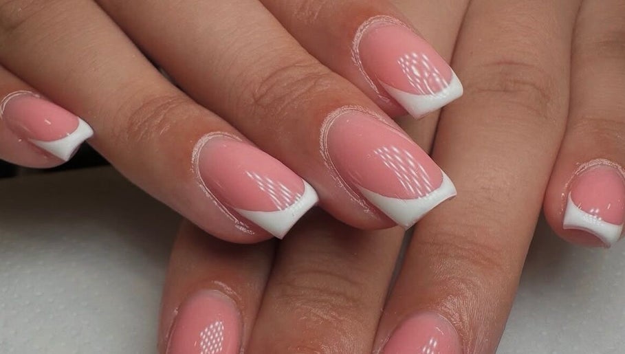 Stylish French manicure at Georgialees Beauty, Solihull, England, GB showcasing pink nails with white tips.