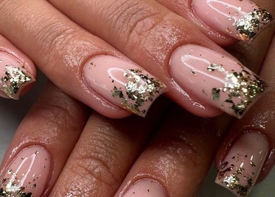 Stylish gold-flaked nails at Georgialees Beauty, Solihull, England, GB. Perfect for an exquisite look.