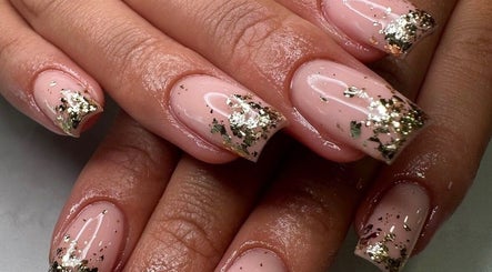 Stylish gold-flaked nails at Georgialees Beauty, Solihull, England, GB. Perfect for an exquisite look.