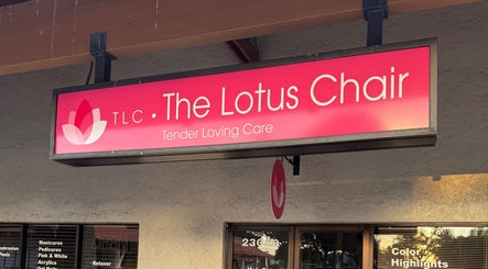 The Lotus Chair salon sign at Boca Raton, Florida, US, showcasing beauty and wellness services.