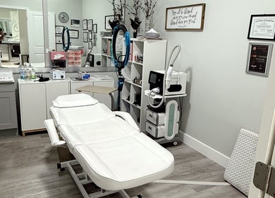 Modern treatment room at The Lotus Chair, Boca Raton, Florida, US, showcasing a sleek spa chair and equipment.