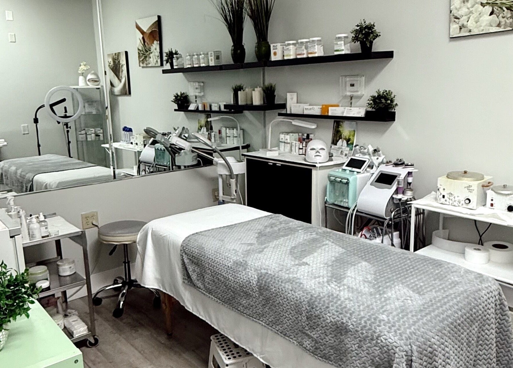 Elegant treatment room at The Lotus Chair in Boca Raton, Florida, US, featuring modern spa equipment and decor.