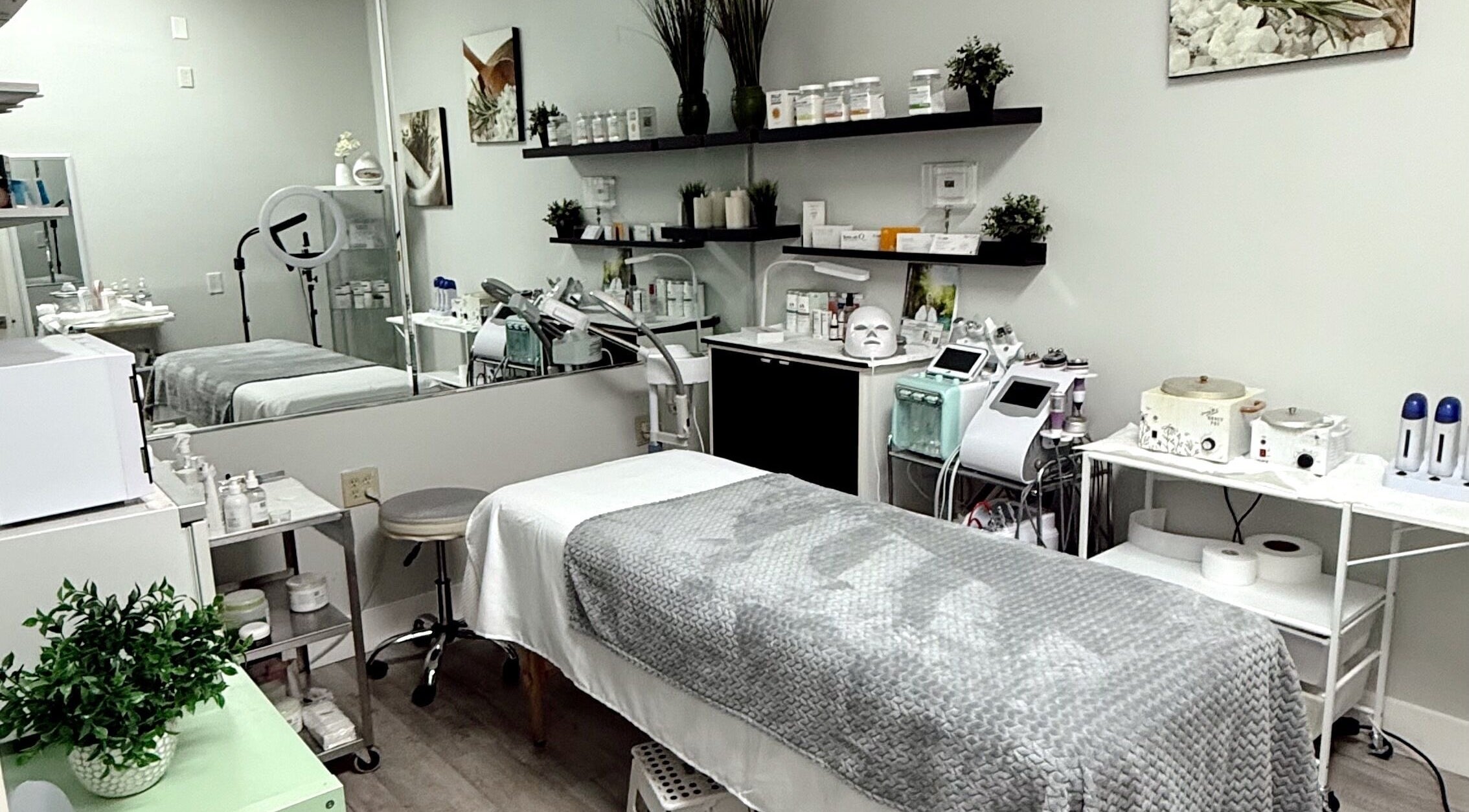 Elegant treatment room at The Lotus Chair in Boca Raton, Florida, US, featuring modern spa equipment and decor.