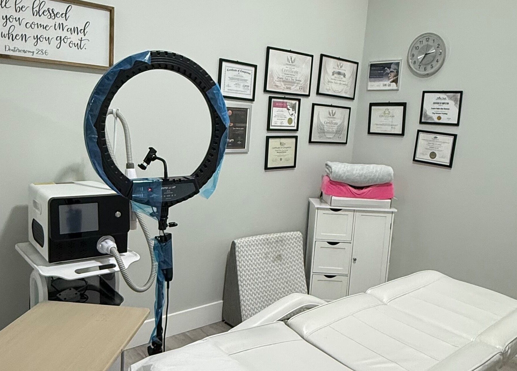 Calming spa room at The Lotus Chair in Boca Raton, Florida, US with treatment bed and equipment.