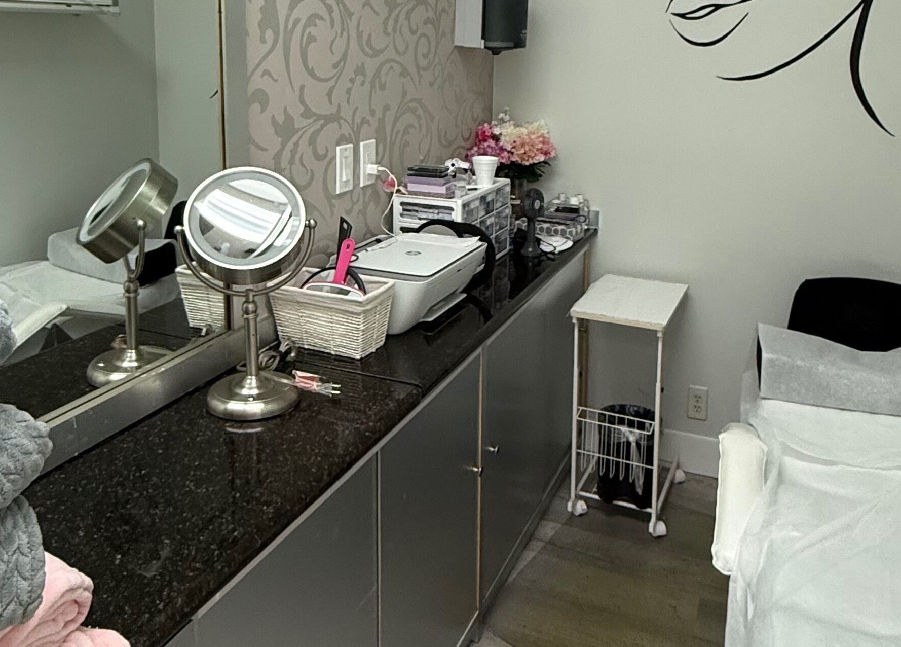 Modern treatment room at The Lotus Chair, Boca Raton, Florida, US featuring elegant decor and cozy amenities.