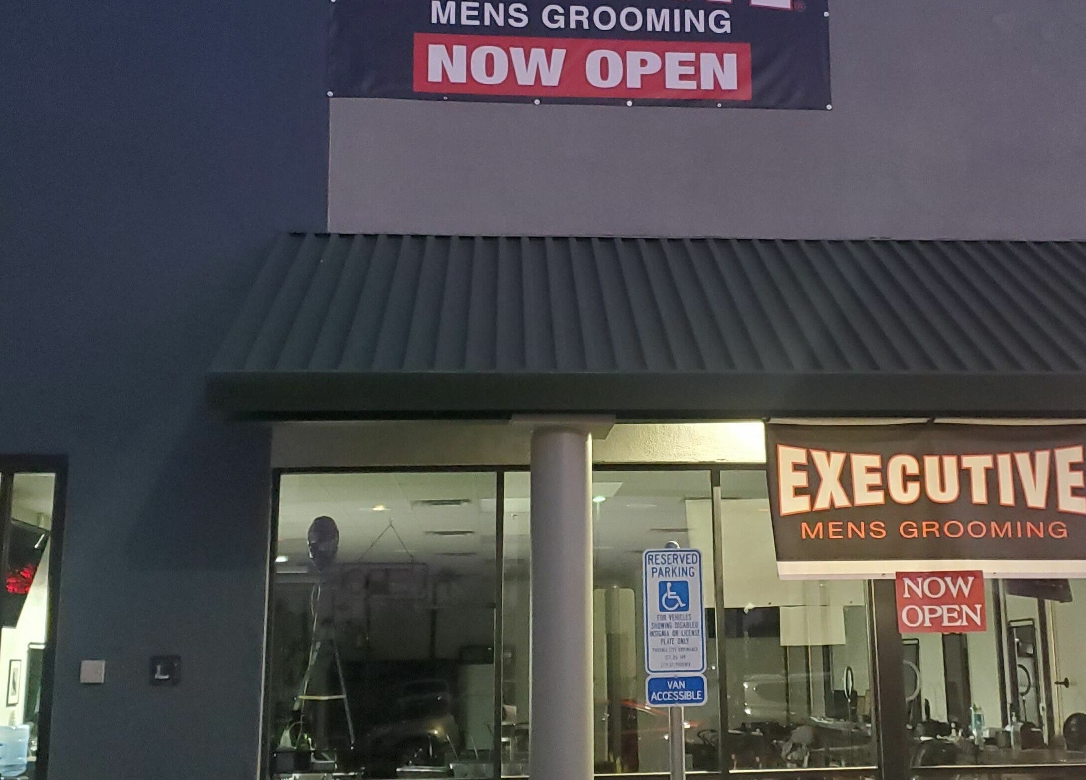 Exterior of Executive Men's Grooming Mesa in Mesa, Arizona, US, with prominent signage showing 'Now Open'.
