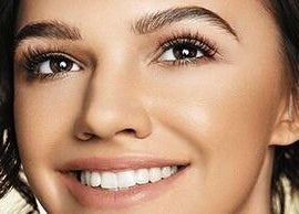 Close-up of a woman's radiant smile and lashes at Lash Ink, Rugby, England, GB.