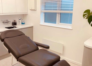 Modern treatment room at Contoured by Holly - Garlinge, Margate, England, GB with sleek bed and decor.