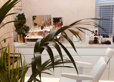 A serene beauty studio at Contoured by Holly - Garlinge in Margate, England, GB with lush greenery and makeup displays.