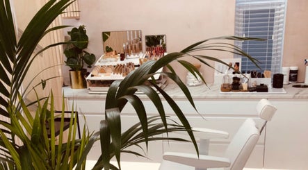 A serene beauty studio at Contoured by Holly - Garlinge in Margate, England, GB with lush greenery and makeup displays.