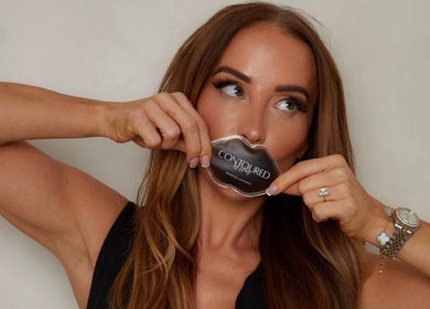 Woman with lip-shaped product at Contoured by Holly - Folkestone, enhancing beauty in Folkestone, England, GB.
