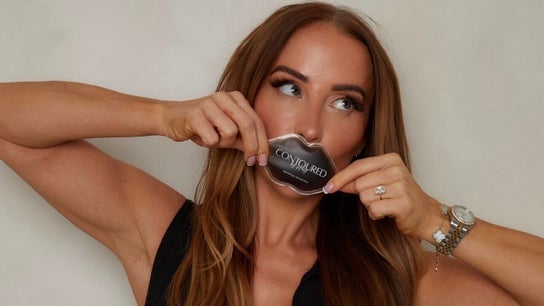 Woman with lip-shaped product at Contoured by Holly - Folkestone, enhancing beauty in Folkestone, England, GB.