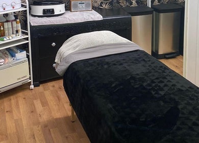 Relaxing treatment room at The Soul Sanctuary, Little Brickhill, England, GB, featuring massage bed and supplies.