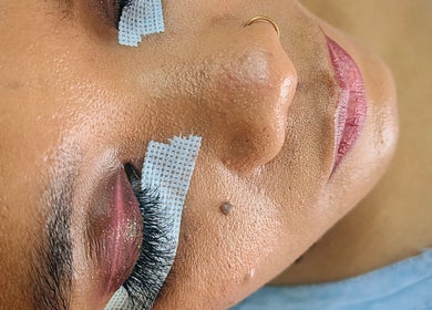 Client receives eyelash treatment at Natural Beauty Salon And Spa in hoedspruit, Gauteng, ZA.